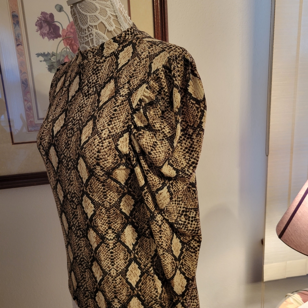 Wild Love turtleneck with snakeskin print.